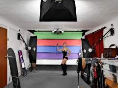 Michelle's Modelling in black strapless bra-top and matching black high-waist girdle, worn as hotpants, c/w tight leather corset-belt