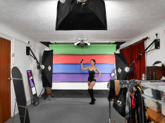 Michelle's Modelling in black strapless bra-top and matching black high-waist girdle, worn as hotpants, c/w tight leather corset-belt