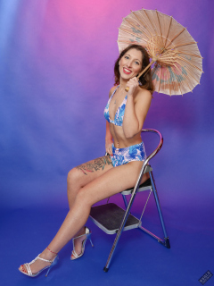 Michelle's Modelling shows off her tiny waist in her own vintage-style blue bikini