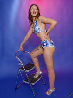 Michelle's Modelling shows off her tiny waist in her own vintage-style blue bikini