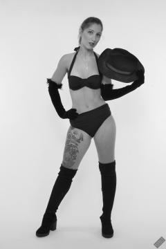 Michelle's Modelling in her own black vintage-style bikini and black suede boots