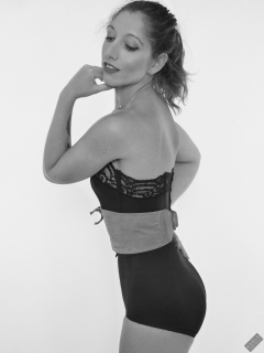 Michelle's Modelling in black strapless bra-top and matching black high-waist girdle, worn as hotpants, c/w tight leather corset-belt