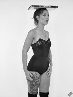 Michelle's Modelling in black strapless bra-top and matching black high-waist girdle, worn as hotpants, c/w tight leather corset-belt
