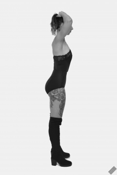 Michelle's Modelling in black strapless bra-top and matching black high-waist girdle, worn as hotpants, c/w tight leather corset-belt