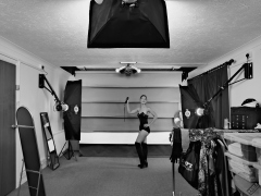 Michelle's Modelling in black strapless bra-top and matching black high-waist girdle, worn as hotpants, c/w tight leather corset-belt
