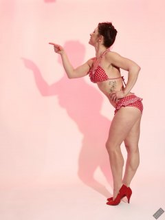 Athena Marie performs her fitness routine, in polka-dot bikini, studio shoot 2023-02-04