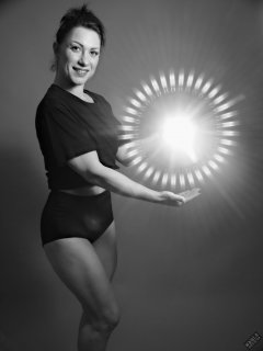 Athena Marie lit by RGB+CCT LED, in knotted T-shirt and vintage black control briefs worn as hotpants, studio shoot 2023-02-04