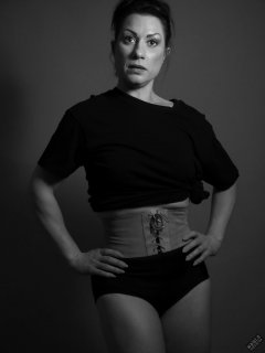 Athena Marie lit by RGB+CCT LED, in knotted T-shirt and vintage black control briefs worn as hotpants, studio shoot 2023-02-04