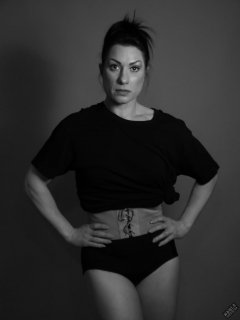 Athena Marie lit by RGB+CCT LED, in knotted T-shirt and vintage black control briefs worn as hotpants, studio shoot 2023-02-04