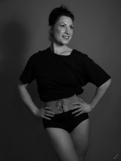 Athena Marie lit by RGB+CCT LED, in knotted T-shirt and vintage black control briefs worn as hotpants, studio shoot 2023-02-04