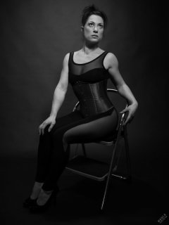 Athena Marie in leotard and tightly-laced underbust corset, studio shoot 2023-02-04