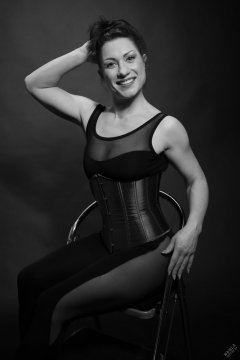 Athena Marie in leotard and tightly-laced underbust corset, studio shoot 2023-02-04