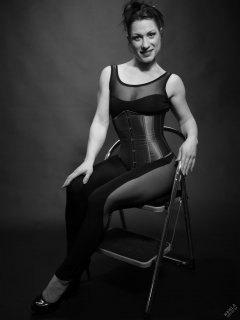 Athena Marie in leotard and tightly-laced underbust corset, studio shoot 2023-02-04