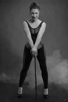Athena Marie in leotard and tightly-laced underbust corset, studio shoot 2023-02-04