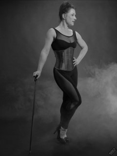 Athena Marie in leotard and tightly-laced underbust corset, studio shoot 2023-02-04