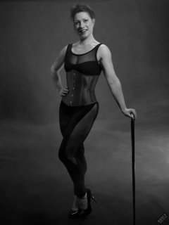 Athena Marie in leotard and tightly-laced underbust corset, studio shoot 2023-02-04