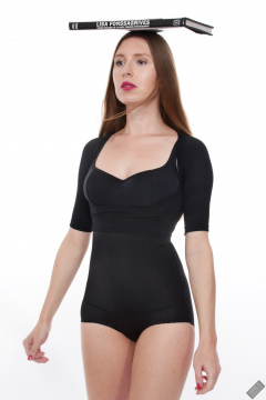 Kaya Lily in black posture top and black high-waisted control briefs worn as hotpants