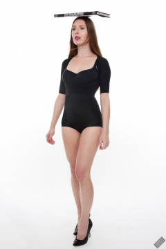 Kaya Lily in black posture top and black high-waisted control briefs worn as hotpants