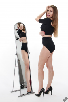 Kaya Lily in black posture top and black control briefs worn as hotpants