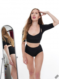 Kaya Lily in black posture top and black control briefs worn as hotpants