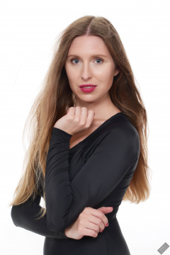 Kaya Lily in black long-sleeved lycra gymnastics leotard