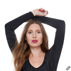 Kaya Lily in black long-sleeved lycra gymnastics leotard
