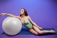 Kaya Lily in her own lime-green one-piece swimsuit