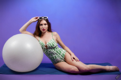 Kaya Lily in her own lime-green one-piece swimsuit