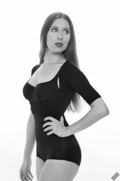 Kaya Lily in black posture top and black high-waisted control briefs worn as hotpants
