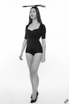 Kaya Lily in black posture top and black high-waisted control briefs worn as hotpants