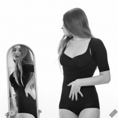 Kaya Lily in black posture top and black high-waisted control briefs worn as hotpants