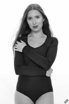 Kaya Lily in black long-sleeved lycra gymnastics leotard