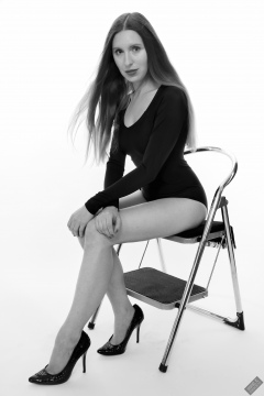 Kaya Lily in black long-sleeved lycra gymnastics leotard