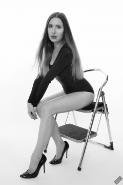 Kaya Lily in black long-sleeved lycra gymnastics leotard