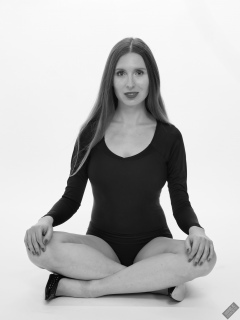 Kaya Lily in black long-sleeved lycra gymnastics leotard