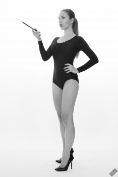 Kaya Lily in black long-sleeved lycra gymnastics leotard