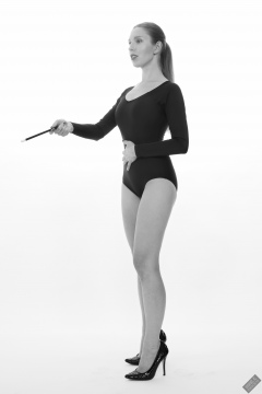 Kaya Lily in black long-sleeved lycra gymnastics leotard