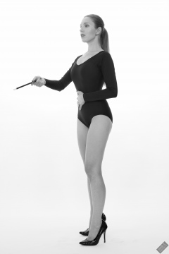 Kaya Lily in black long-sleeved lycra gymnastics leotard