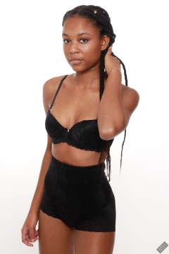 Caleann models black bra top and black waist trainer control briefs, worn as hotpants