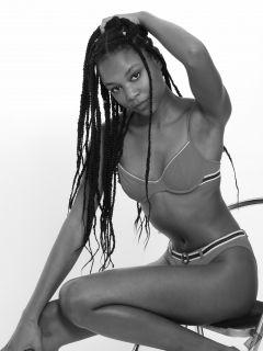 Caleann models simple red sixties-style belted bikini