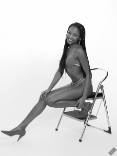 Caleann models simple red sixties-style belted bikini