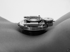 Caleann poses with vintage Bausch & Lomb shutter c/w Beck lens assembly on her tightly tucked-in tummy