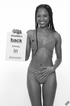 Caleann models simple red sixties-style belted bikini