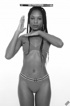 Caleann models simple red sixties-style belted bikini