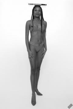 Caleann models simple red sixties-style belted bikini