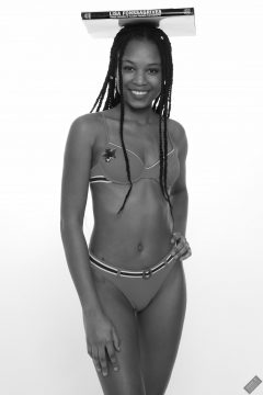 Caleann models simple red sixties-style belted bikini