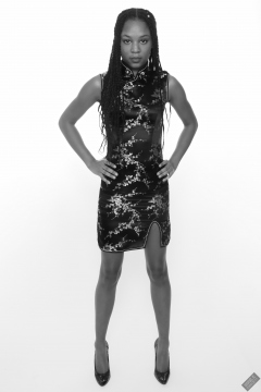 Caleann in tight black-and-gold Chinese cheongsam dress