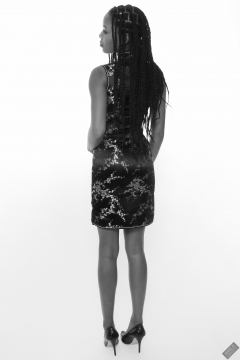 Caleann in tight black-and-gold Chinese cheongsam dress