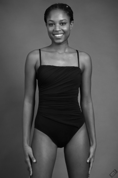 Caleann in tight black vintage-style tummy-control one-piece swimsuit by M&S