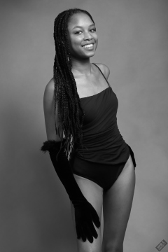 Caleann in tight black vintage-style tummy-control one-piece swimsuit by M&S